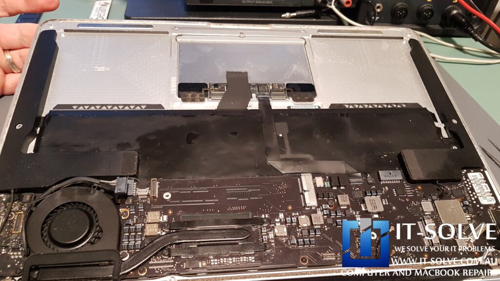 Macbook logic board cleaned with some sort of oily substance by the customer in an attempt to fix it