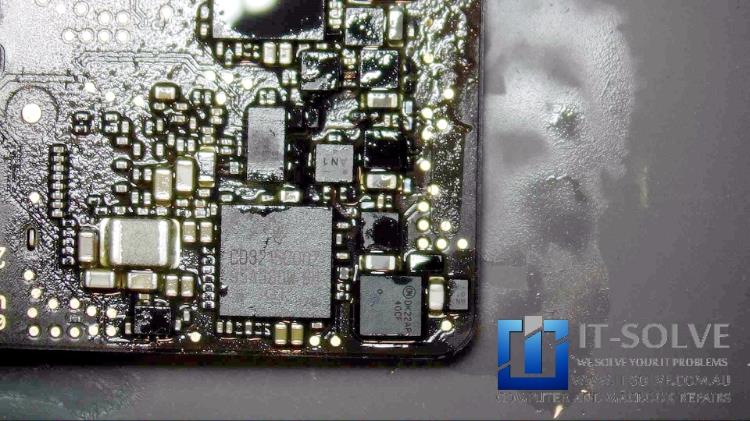 Re-soldering traces and replacing corroded components on Macbook Air A1932